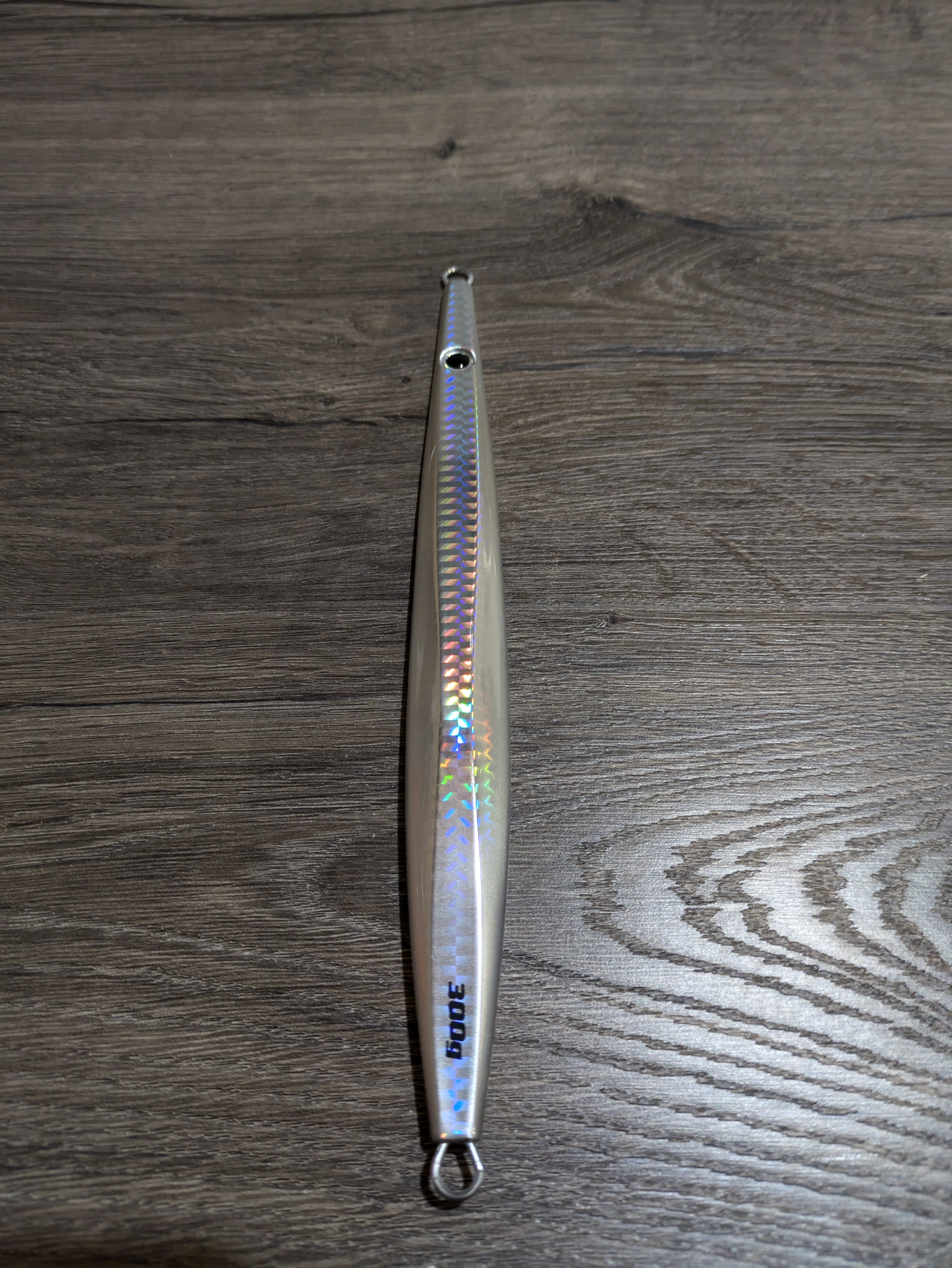 TJC101 The Taurus Slow Pitch Jig: Ghost Sliver Flash with Glow.